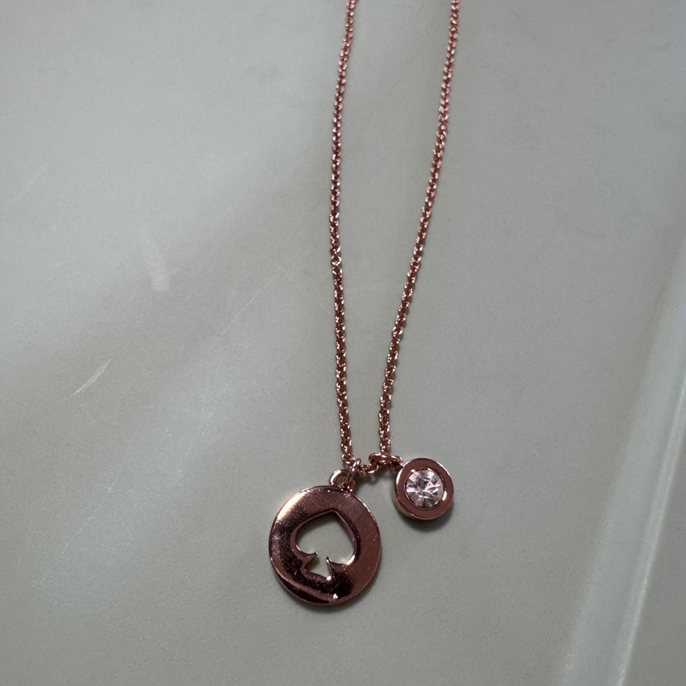 Kate Spade New York "Spot The Spade" rose gold charm necklace
